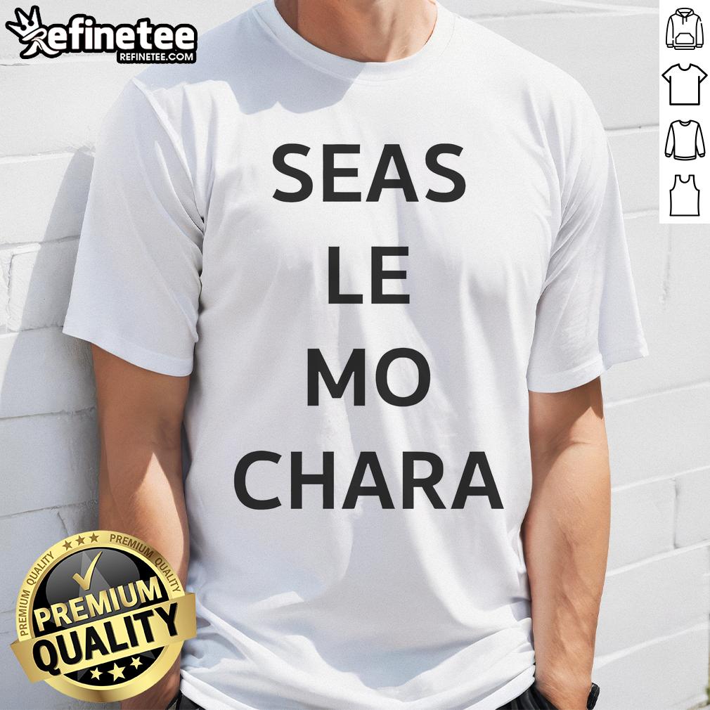 Premium Le Boom Wearing Seas Le Mo Chara T Shirt Alt Text: Premium Le Boom models the Seas Le Mo Chara T-shirt, showcasing vibrant design and stylish fit for casual wear.