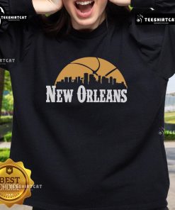 Alt Text: Premium New Orleans Pelicans cityscape skyline style 2025 sweatshirt featuring vibrant colors and team logo design.