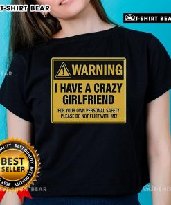 Premium warning tee shirt: 'I Have A Crazy Girlfriend' message for personal safety, perfect for humorous fashion.