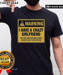 Alt Text: Premium warning t-shirt featuring 'I Have A Crazy Girlfriend' message for personal safety and humor in relationships.