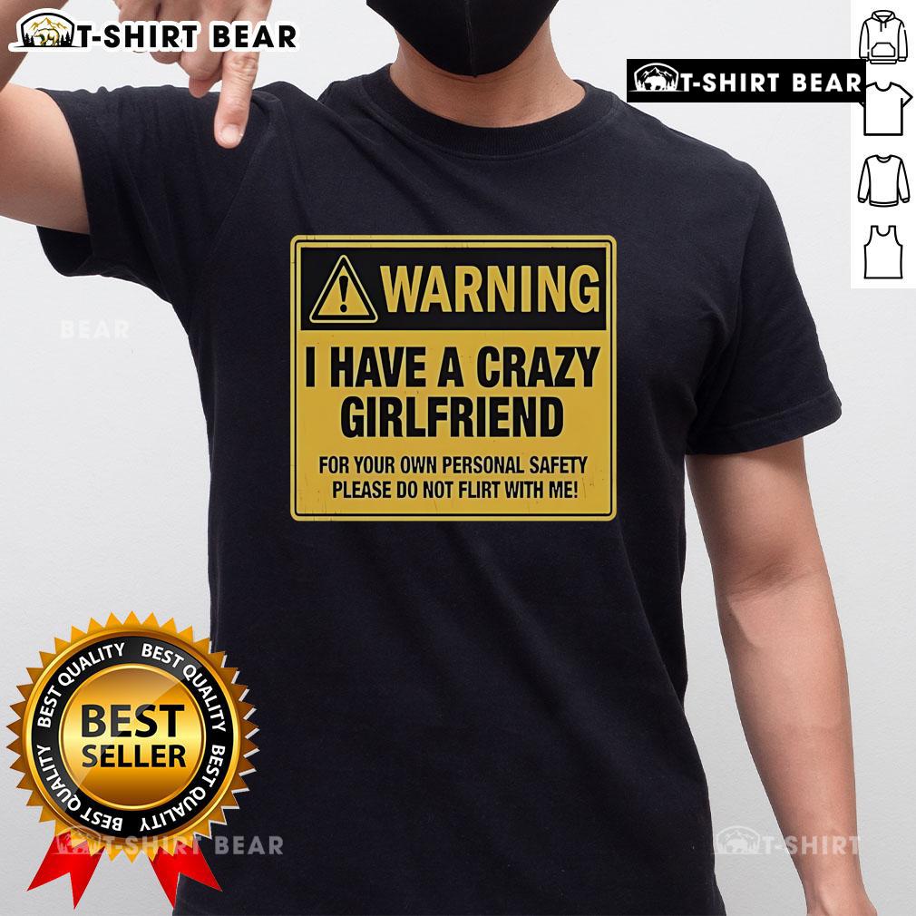 Premium Warning I Have A Crazy Girlfriend For Your Own Personal Safety Please Do Not Flirt With Me T-Shirt Alt Text: Premium warning t-shirt featuring 'I Have A Crazy Girlfriend' message for personal safety and humor in relationships.