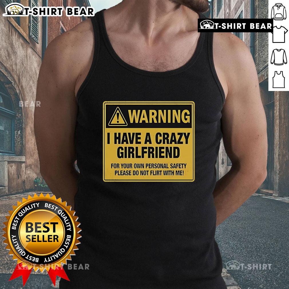 Premium Warning I Have A Crazy Girlfriend For Your Own Personal Safety Please Do Not Flirt With Me Tank Top Premium warning tank top stating 'I have a crazy girlfriend, please do not flirt with me' for a fun, bold style.