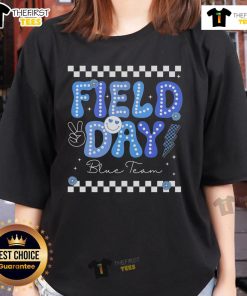 Blue team ladies compete in colorful field day trip games, showcasing teamwork and fun in vibrant attire.