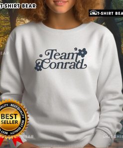 Pretty Team Conrad Sweatshirt featuring a stylish design, perfect for fans of the popular series and cozy casual wear.