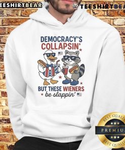 Funny Fourth of July hoodie featuring a duck and raccoon with the phrase 'Democracy's collapsing, but these wieners be slapping.'