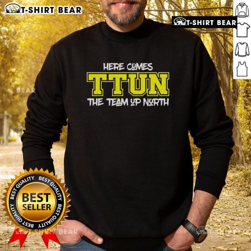 Cozy 'Here Comes Ttun' sweatshirt featuring a northern-themed design, perfect for team spirit and casual wear.