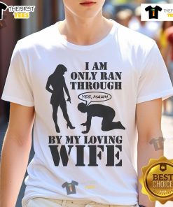 Alt Text: Top I Am Only Ran Through By My Loving Wife T-Shirt design featuring playful text and casual style for couples.