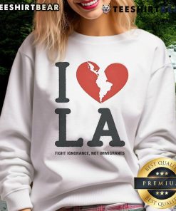 Top I Heart Broken LA Fight Ignorance Not Immigrants sweatshirt showcasing a bold message on social justice and inclusivity.