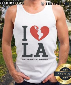 Model wearing 'I Heart Broken LA' tank top, promoting the message 'Fight Ignorance, Not Immigrants' in a stylish design.