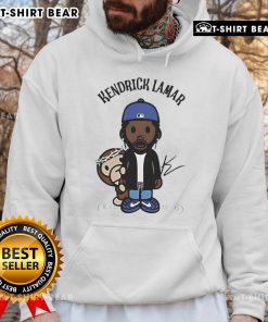 Alt Text: Kendrick Lamar wearing a chibi monkey hoodie, showcasing vibrant artwork and streetwear style.