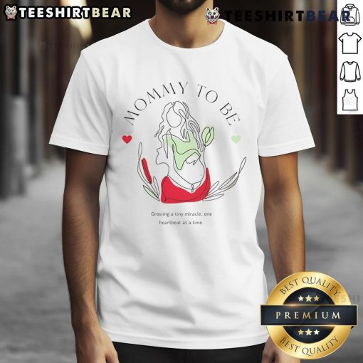 Alt Text: Top Mommy To Be Growing A Tiny Miracle T-Shirt featuring a cute baby bump design for expectant mothers.
