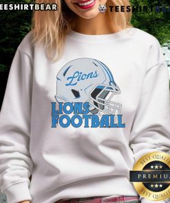 Alt Text: Top NFL Detroit Lions football helmet sweatshirt featuring team colors and logo for fans and sports enthusiasts.