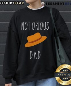 Trendy Top No-Torious Dad Hat Sweatshirt displayed on a mannequin, perfect for casual wear and stylish outfits.