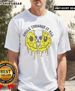 Top Skull Smile Through It All T-Shirt featuring a bold skull graphic and inspirational text for a unique style.