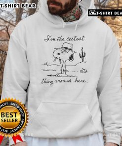 Adorable Snoopy hoodie featuring 'I'm the cutest thing around here' design, perfect for casual wear and dog lovers.