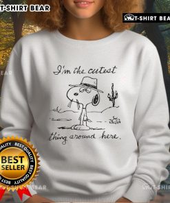 Top Snoopy I'm The Cutest Thing Around Here sweatshirt featuring a playful Snoopy graphic on a cozy background.