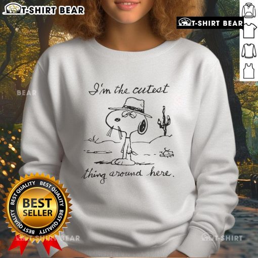 Top Snoopy I'm The Cutest Thing Around Here sweatshirt featuring a playful Snoopy graphic on a cozy background.