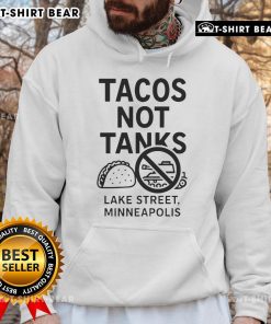 Alt Text: Top Tacos Not Tanks hoodie showcased in Minneapolis, emphasizing local culture and vibrant street style.