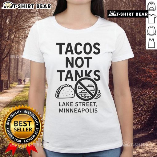 Top Tacos Not Tanks Lake Street Minneapolis Ladies Tee featuring vibrant taco graphic on a stylish women's shirt.