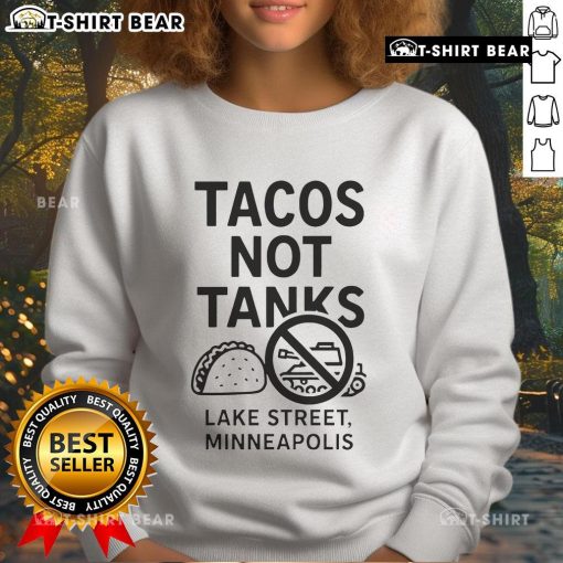 Cozy sweatshirt featuring Top Tacos Not Tanks design, perfect for Minneapolis street style enthusiasts.