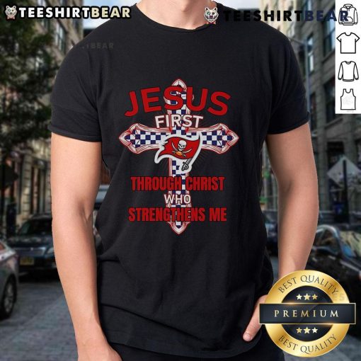 Alt Text: Top Tampa Bay Buccaneers Jesus First T-Shirt featuring 'Through Christ Who Strengthens Me' design for fans.