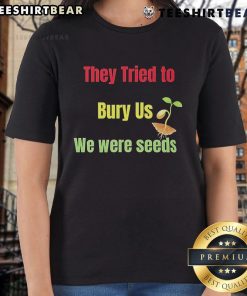 Top They Tried To Bury Us We Were Seeds Ladies Tee in vibrant color, showcasing an empowering message for women.
