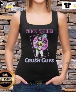 Girl in a gym wearing a 'Top Thick Thighs Crush Guys' tank top, showcasing fitness and style.