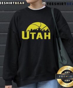 Stylish 2025 Utah Jazz cityscape skyline sweatshirt featuring vibrant colors and team logo, perfect for fans.