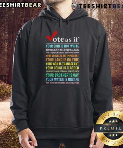 Person wearing 'Top Vote As If Your Skin Is Not White' hoodie, promoting awareness for healthcare equality and justice.