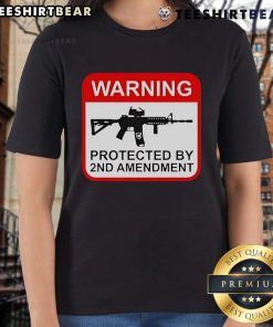 Alt Text: Top warning graphic on a 2nd Amendment ladies tee, promoting gun rights and women's empowerment in stylish apparel.