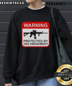Top Warning Protected by 2nd Amendment Sweatshirt featuring bold text on a cozy, stylish design for gun rights supporters.