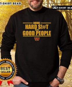Top Washington Commanders sweatshirt featuring 'Doing Hard Shit With Good People' design, perfect for fans and casual wear.
