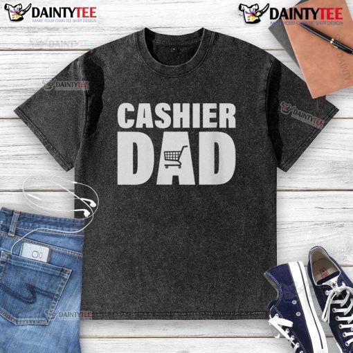 Awesome Cashier Dad wearing a washed T-shirt, smiling while working at the register in a vibrant grocery store.