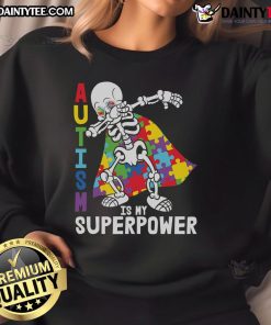 Awesome dabbing skeleton wearing an autism awareness puzzle cape on a sweatshirt, showcasing superpower pride.