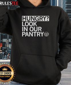 Person wearing the Awesome Hungry Look in Our Pantry hoodie, showcasing a fun food-themed design in a cozy kitchen.