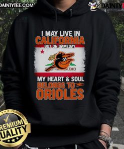 Person wearing an Orioles hoodie, showcasing team spirit on game day while living in California.