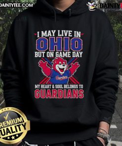 Fan wearing a Cleveland Guardians hoodie, showcasing team spirit on game day in Ohio.