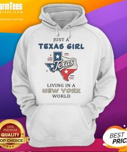 Alt Text: A Texas girl in a cozy hoodie that reads 'Awesome Just A Texas Girl Living In A New York World' against a city backdrop.