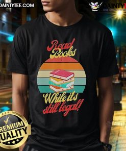 Vintage sunset t-shirt featuring 'Awesome Read Books While It's Still Legal' slogan, perfect for book lovers and casual wear.