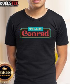 Awesome Team Conrad Logo T-Shirt featuring a bold design and vibrant colors, perfect for team spirit and casual wear.