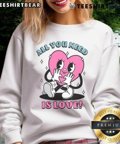 Alt Text: Cute All You Need Is Love sweatshirt featuring a heart design, perfect for cozy casual outfits.