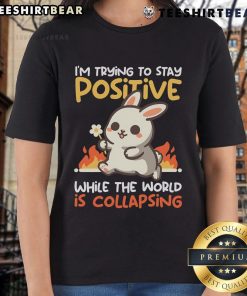 Adorable bunny graphic on a ladies' tee, promoting positivity amid chaos with the phrase Trying to Stay Positive.