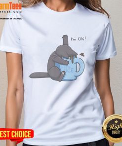 Cute cat playfully drowning in a coffee cup, featured on an I'm Ok ladies tee, perfect for cat lovers and coffee enthusiasts.