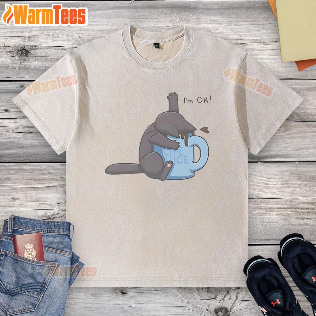 Cute Cat Drowning In Coffee Cup I'M Ok Washed T Shirt Cute cat playfully sitting in a coffee cup, wearing a 'I'm OK' washed t-shirt, showcasing its adorable personality.