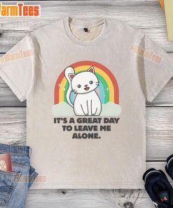 Cute cat lounging in a sunbeam, wearing a It's a Great Day to Leave Me Alone washed t-shirt, radiating relaxation.