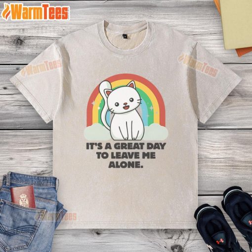 Cute cat lounging in a sunbeam, wearing a It's a Great Day to Leave Me Alone washed t-shirt, radiating relaxation.