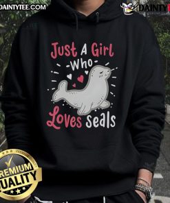 Cute girl wearing a 'Just A Girl Who Loves Seals' hoodie, smiling with a seal plush toy, showcasing her love for seals.