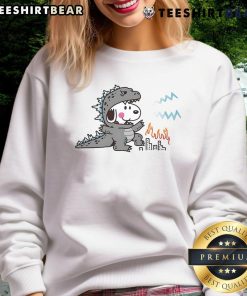Cute Snoopy in a Godzilla disguise on a cozy sweatshirt, perfect for fans of unique and whimsical apparel.