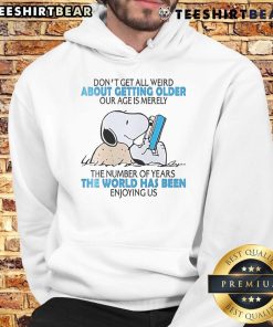 Cute Snoopy hoodie with text 'Don't Get All Weird About Getting Older' celebrating age with style and humor.