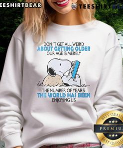 Alt Text: Cute Snoopy sweatshirt with 'Don't get all weird about getting older' message, perfect for casual wear.